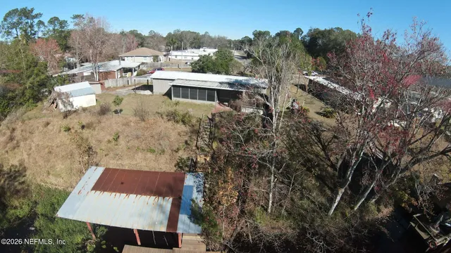 a view of a backyard of the house