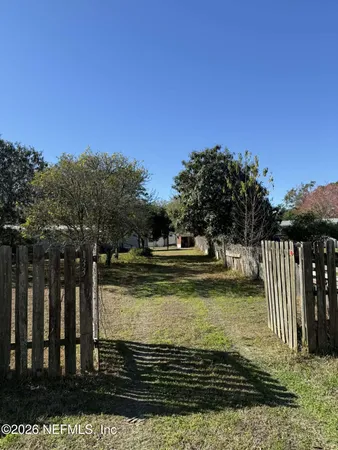 a view of a backyard of the house