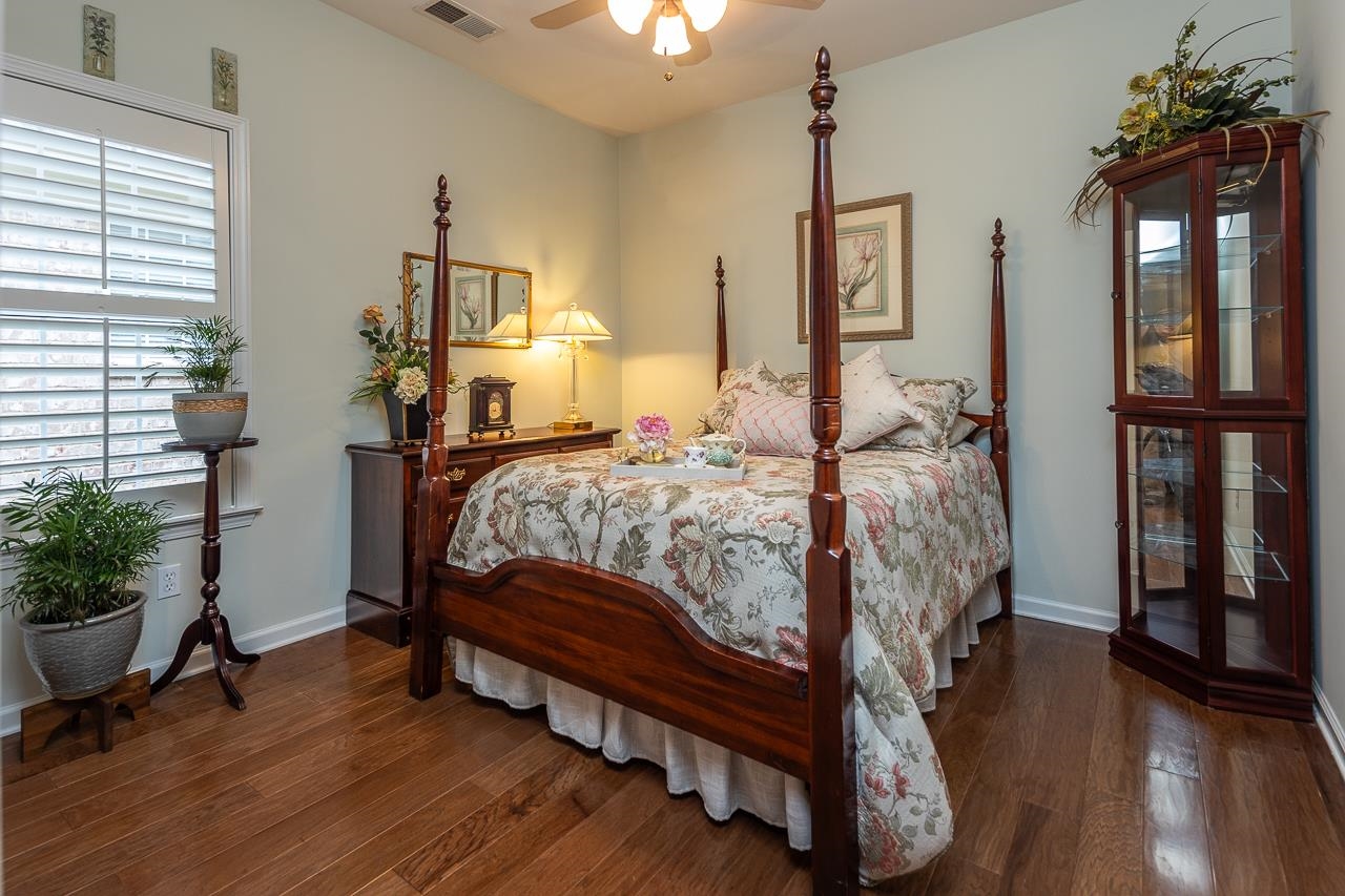 6031 Grayce Drive Bartlett, TN 38134 - Photo 17 of 31 a bedroom with a bed table closet and a window