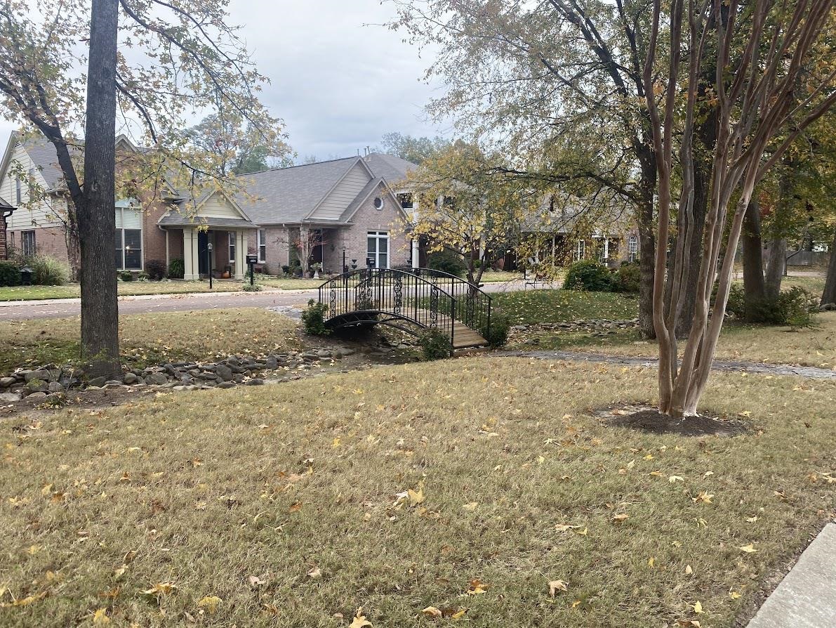 6031 Grayce Drive Bartlett, TN 38134 - Photo 23 of 31 a front view of a house with a yard covered in snow