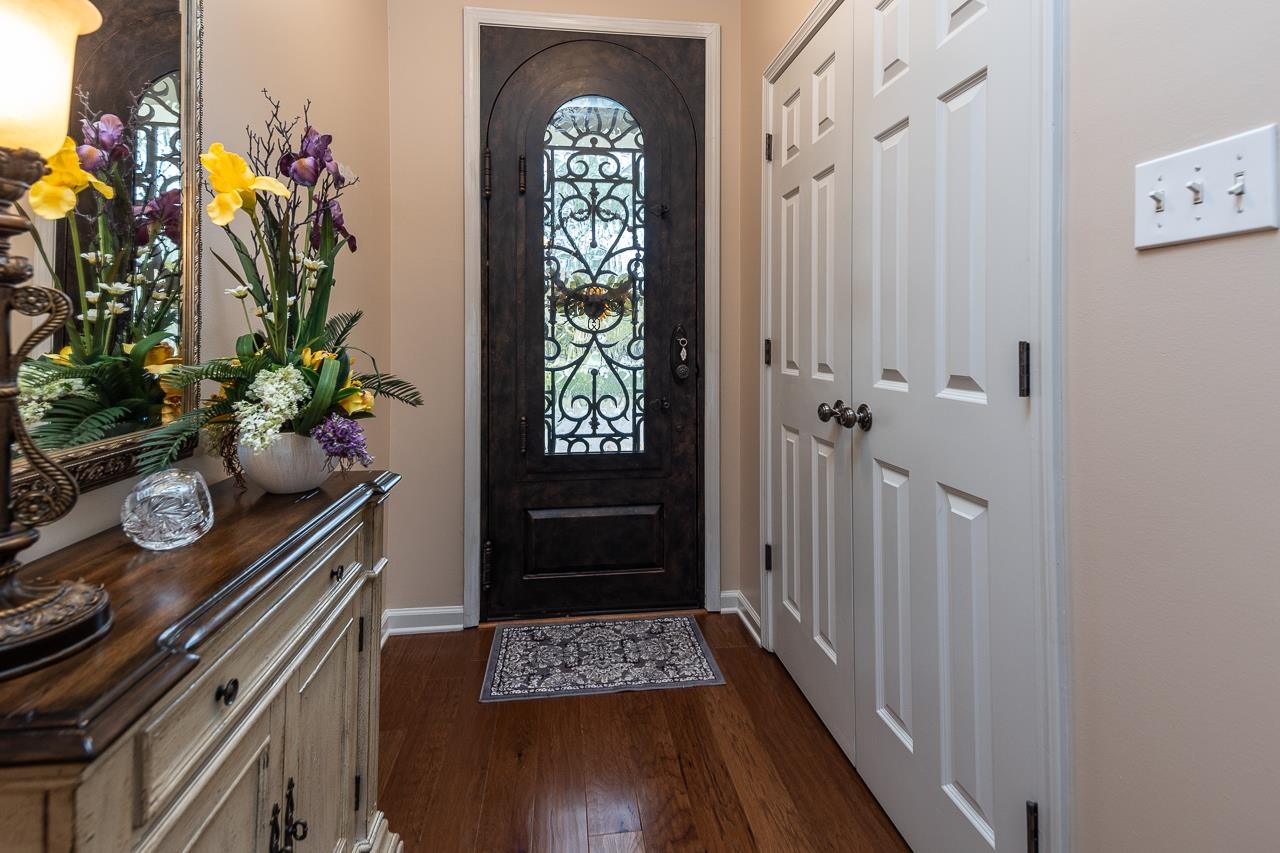 6031 Grayce Drive Bartlett, TN 38134 - Photo 3 of 31 a hallway with painting on the wall and a potted plant