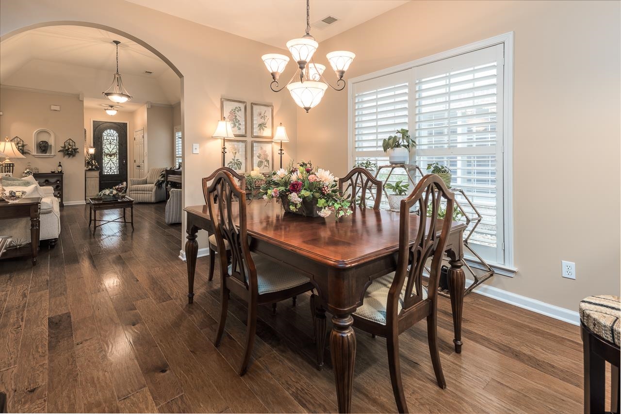 6031 Grayce Drive Bartlett, TN 38134 - Photo 8 of 31 a view of a dining room with furniture and wooden floor