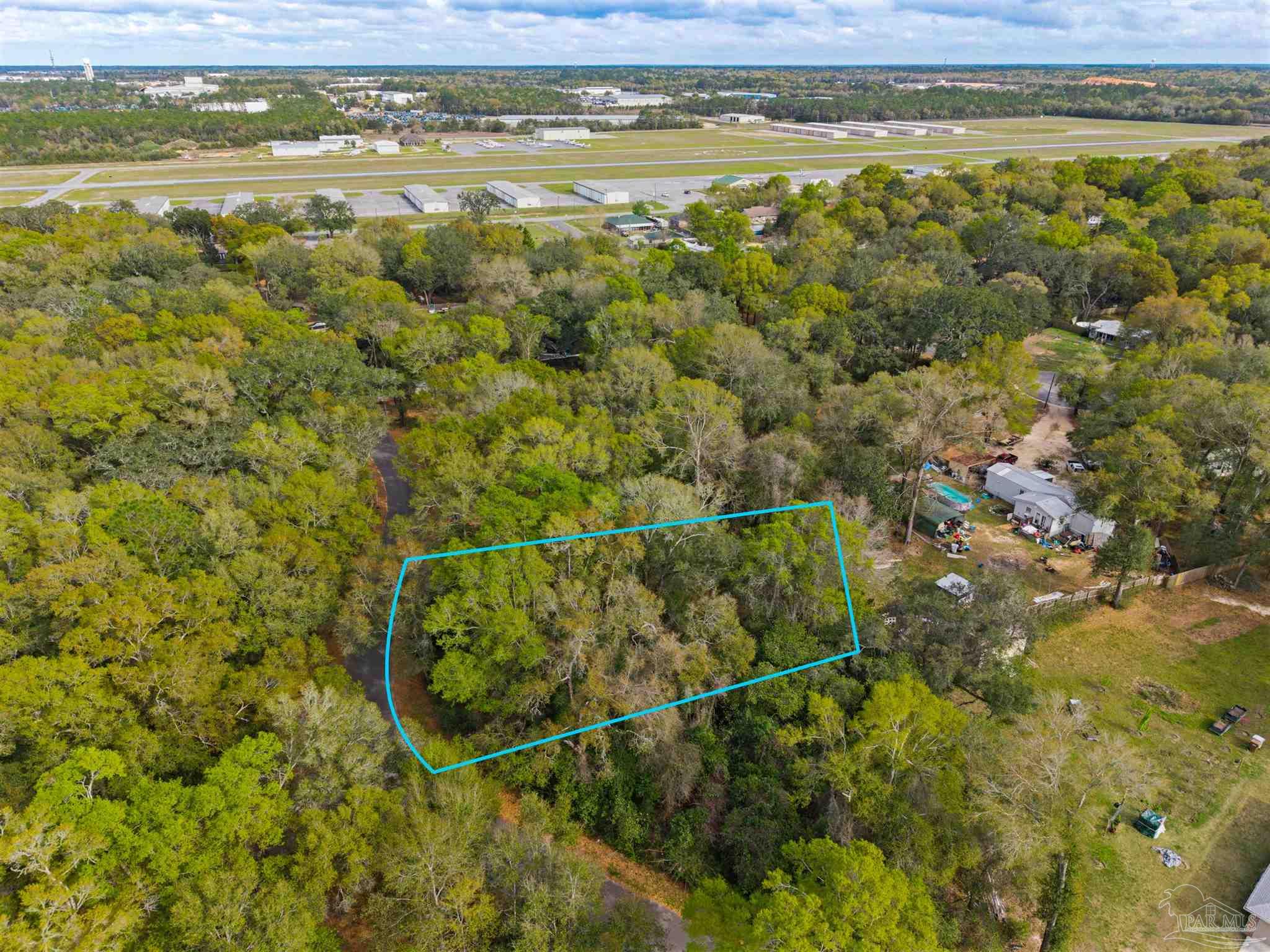 7725 Elrod Road Milton, FL 32583 - Photo 6 of 16 a view of a yard with an outdoor space