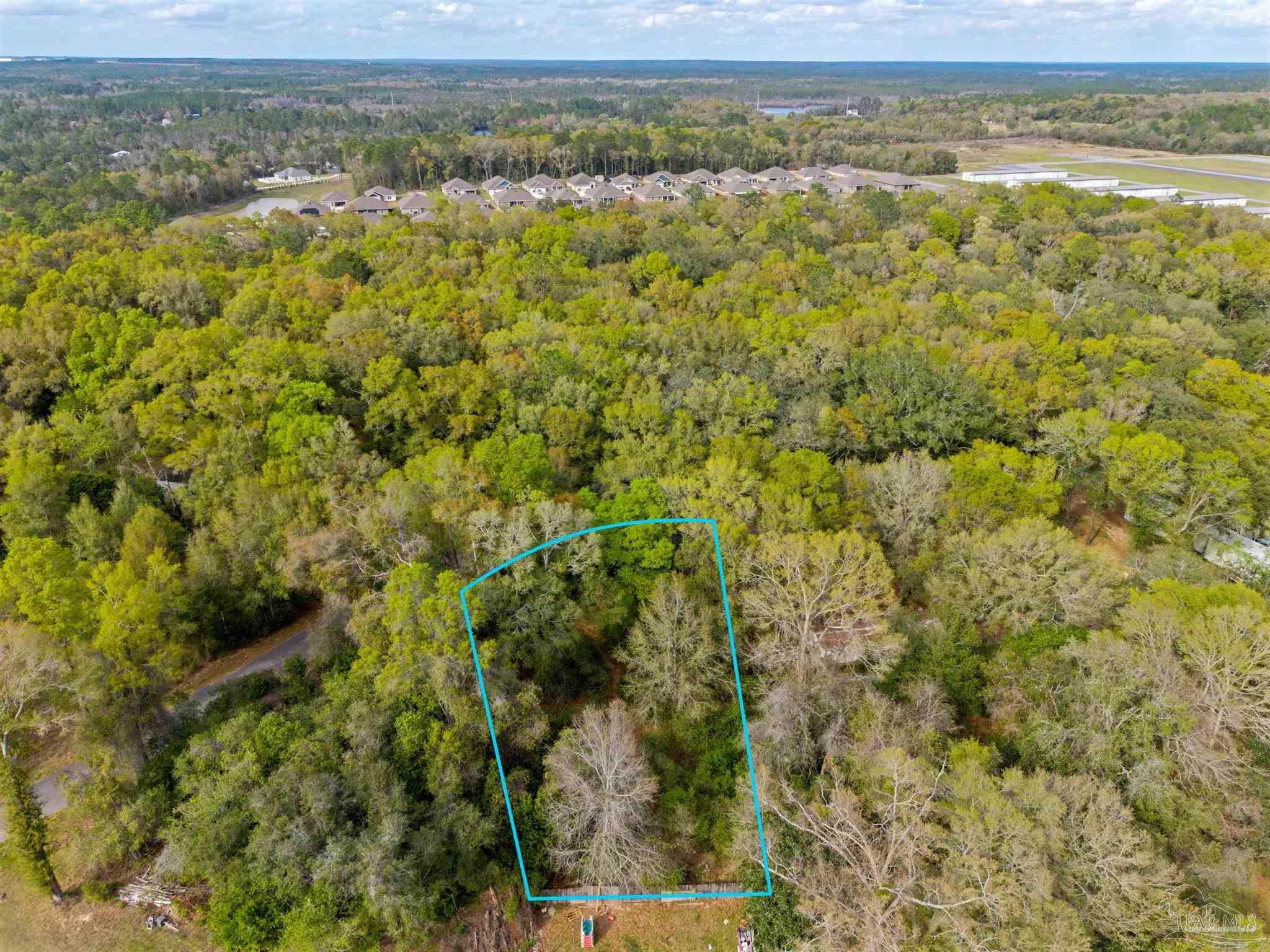 7725 Elrod Road Milton, FL 32583 - Photo 8 of 16 a view of a yard with an outdoor space
