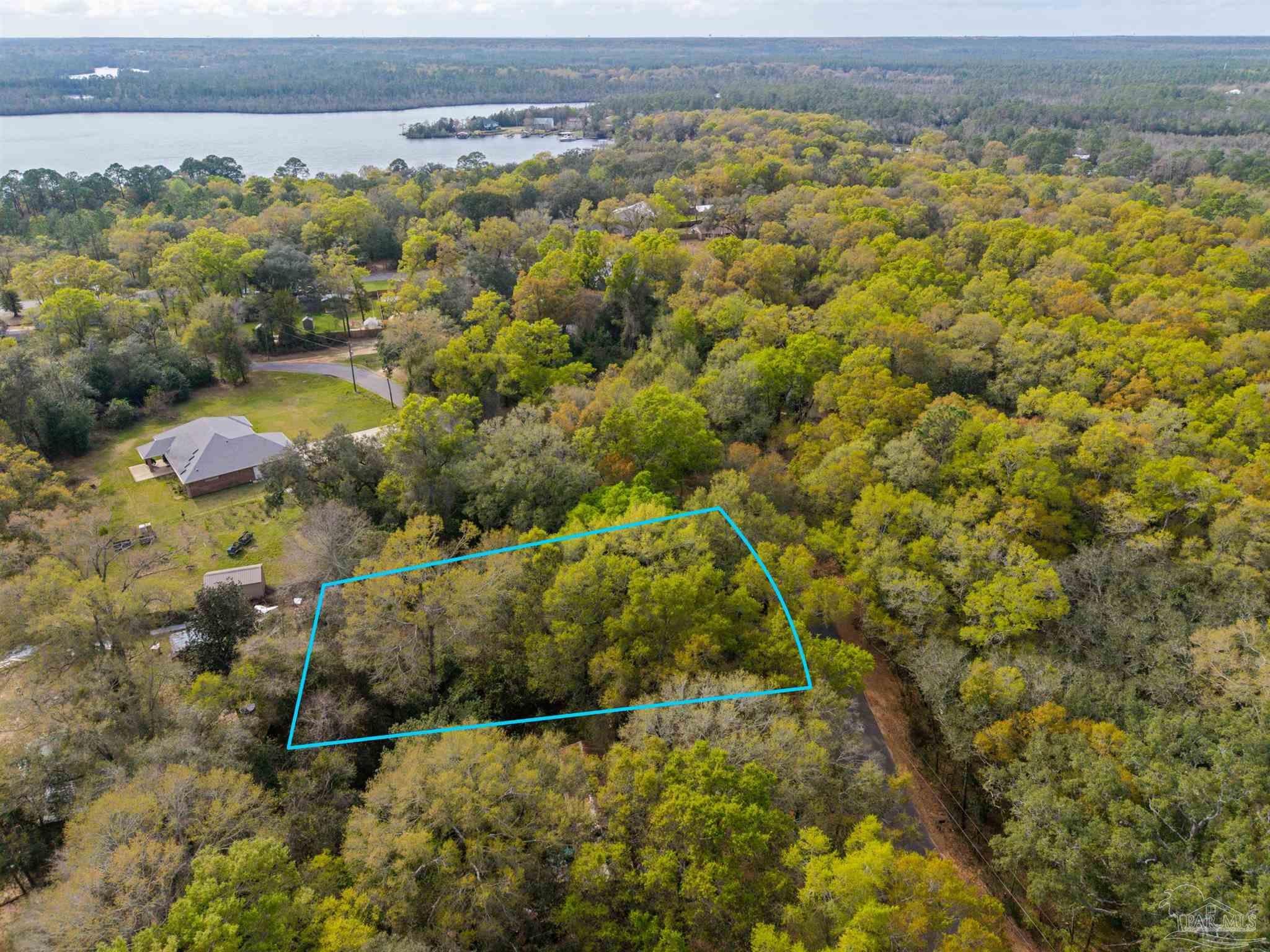 7725 Elrod Road Milton, FL 32583 - Photo 10 of 16 a view of lake