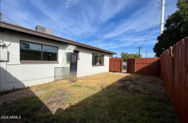 a house view with a backyard space