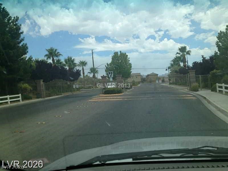 8897 Houston Ridge Avenue Las Vegas, NV 89178 - Photo 11 of 12 Enter a community through stately gates with meticulously maintained landscaping.