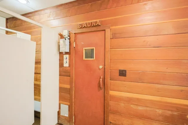 a view of a yard with wooden fence