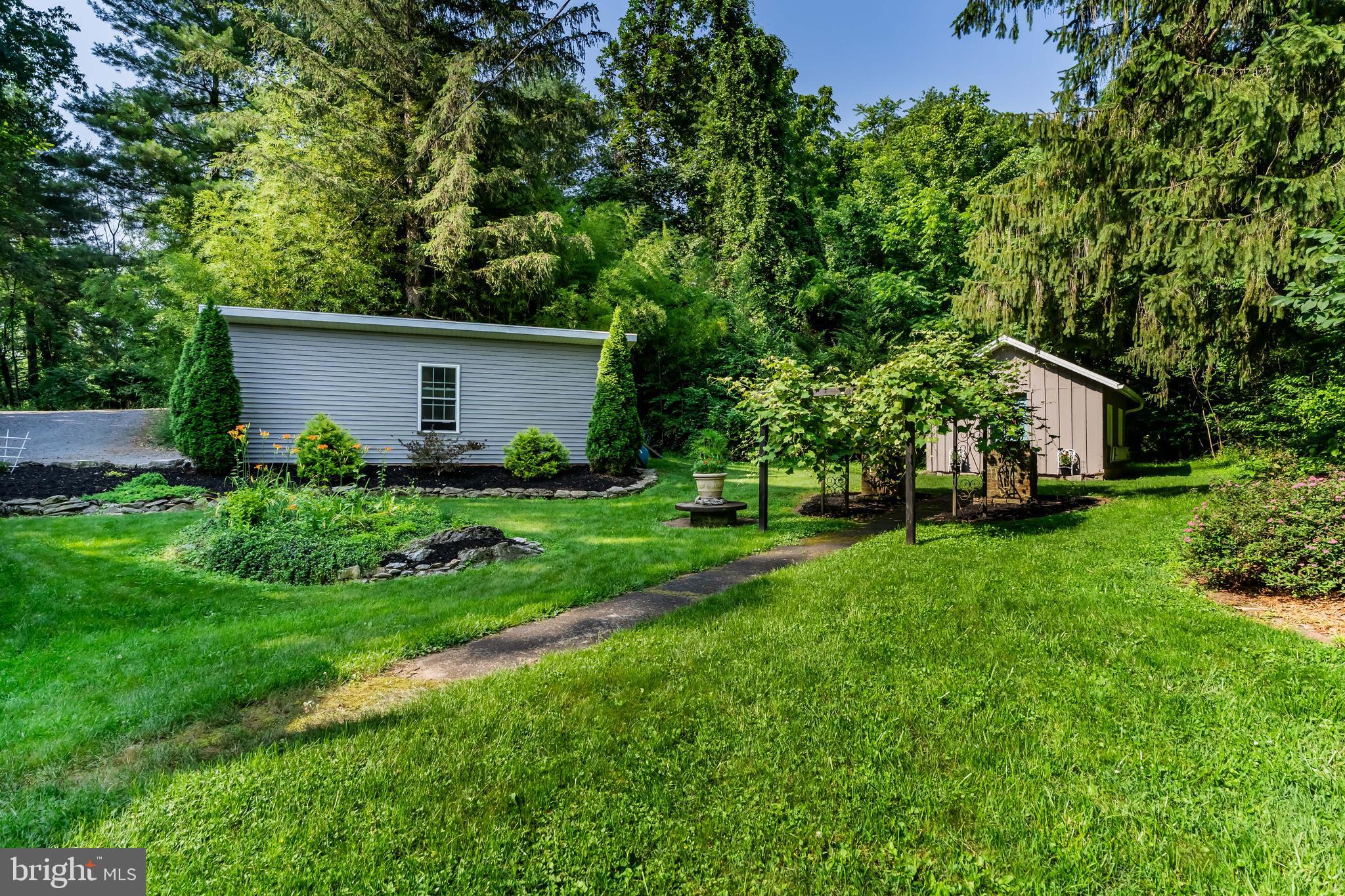2123 Ritner Highway Carlisle, PA 17015 - Photo 61 of 72 Lawn shed gives lots of space for tractor & tools