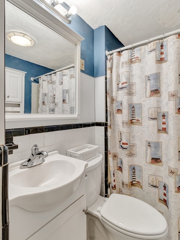 5 G Street Hull, MA 02045 - Photo 25 of 41 a bathroom with a sink toilet and shower