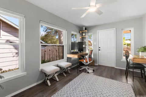 a view of a backyard with sitting area