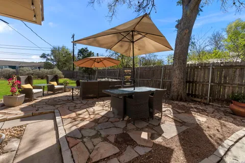 a view of a house with a yard porch and sitting area