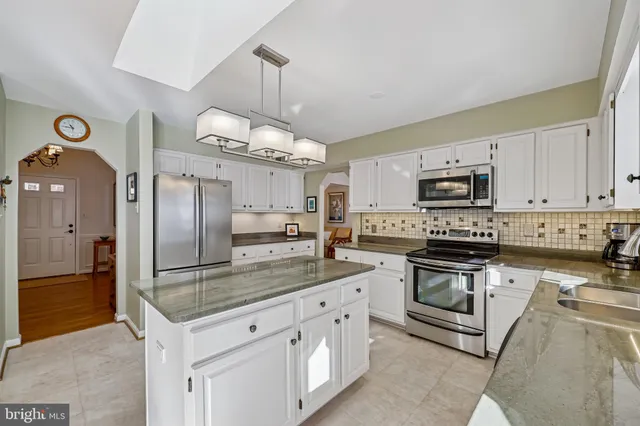 a living room with fireplace furniture and a flat screen tv
