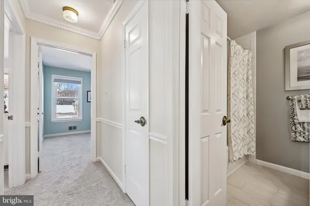 a bedroom with a large bed and a flat screen tv