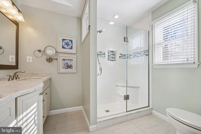 an empty room with furniture and a chandelier