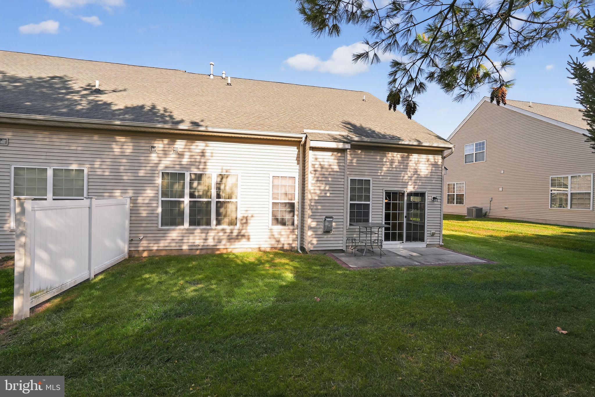 137 Stoyer Road Coatesville, PA 19320 - Photo 21 of 21 a view of a house with a yard and a patio