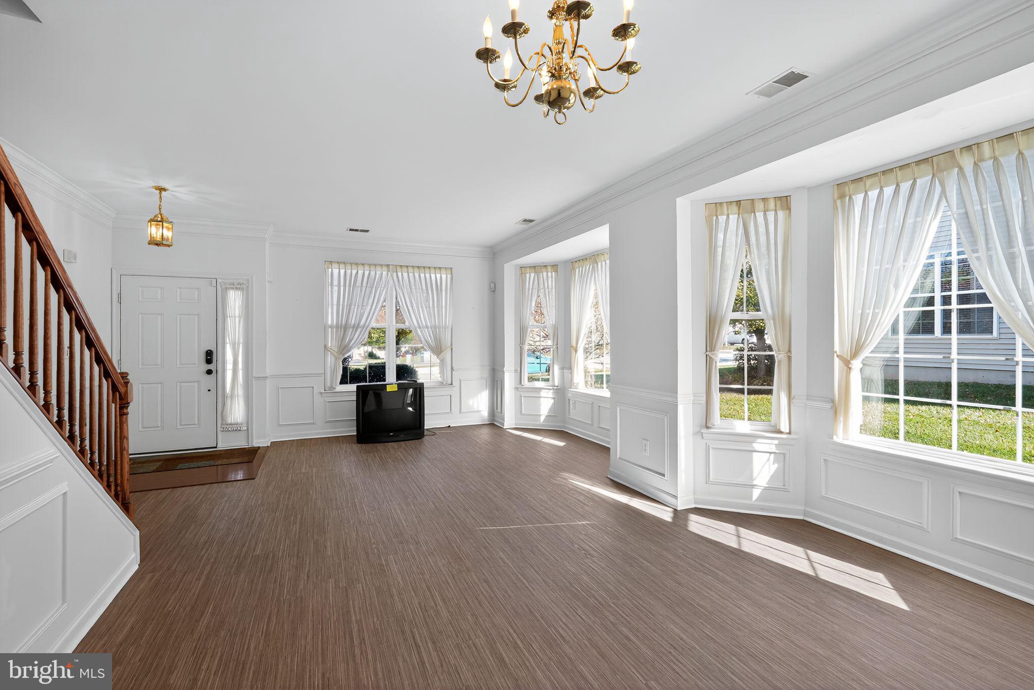137 Stoyer Road Coatesville, PA 19320 - Photo 3 of 21 a view of a livingroom with wooden floor and windows