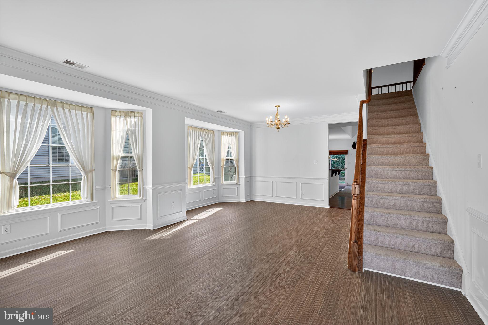 137 Stoyer Road Coatesville, PA 19320 - Photo 4 of 21 a view of an empty room with wooden floor and a window