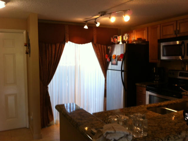 1068 Jeffery Street Boca Raton, FL 33487 - Photo 4 of 13 a bedroom with a bed and a walk in closet