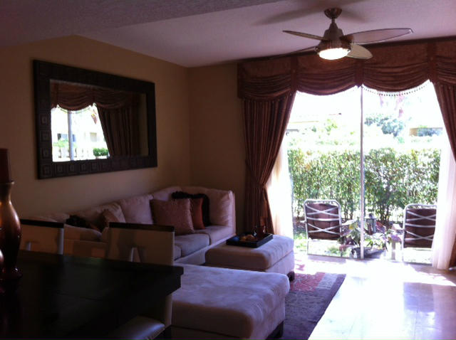 1068 Jeffery Street Boca Raton, FL 33487 - Photo 6 of 13 a living room with furniture and a large window