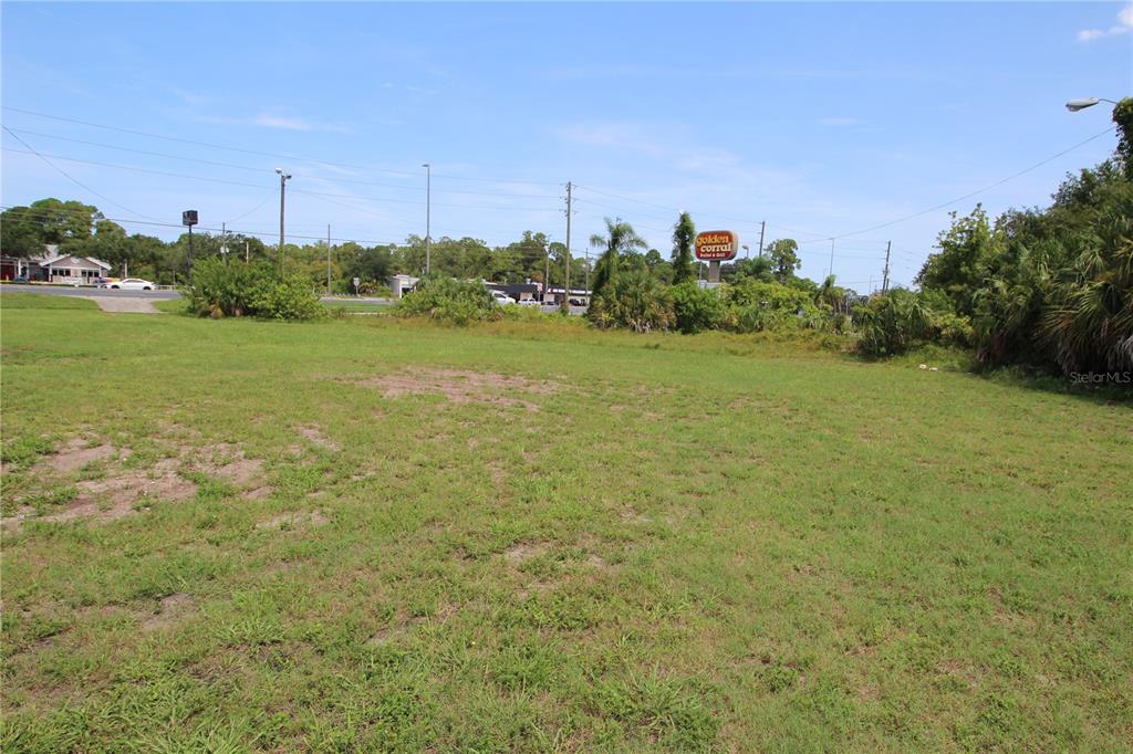 8900 U.S. Highway 19 Port Richey, FL 34668 - Photo 17 of 27 a view of a field with an ocean in the background
