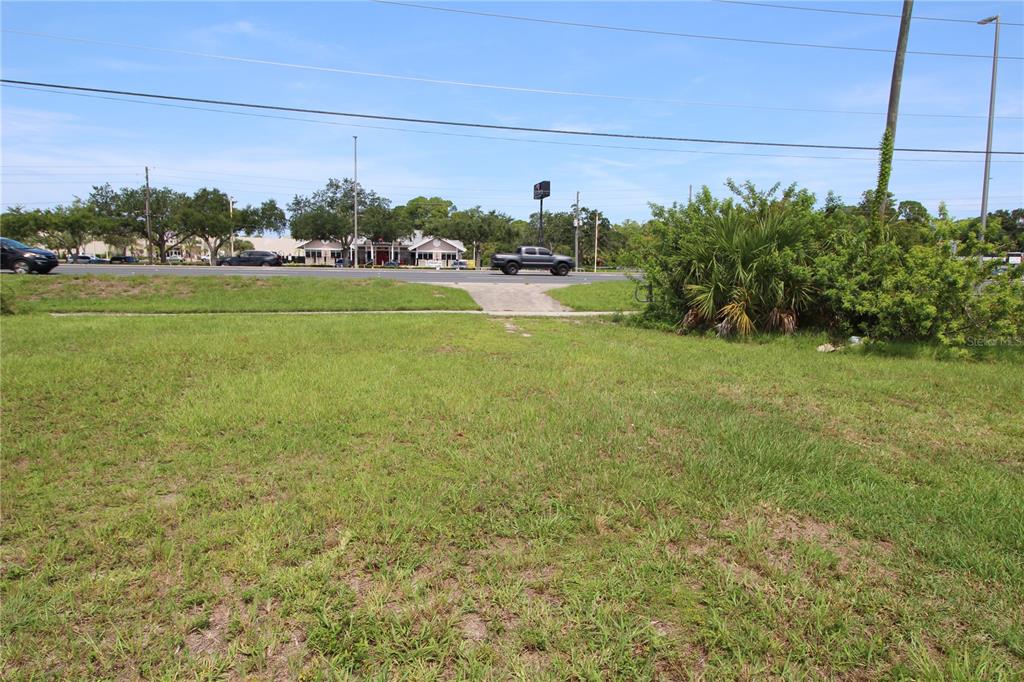 8900 U.S. Highway 19 Port Richey, FL 34668 - Photo 22 of 27 a view of a big yard with potted plants