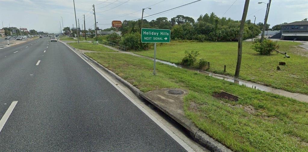 8900 U.S. Highway 19 Port Richey, FL 34668 - Photo 8 of 27 a view of a golf course with a park
