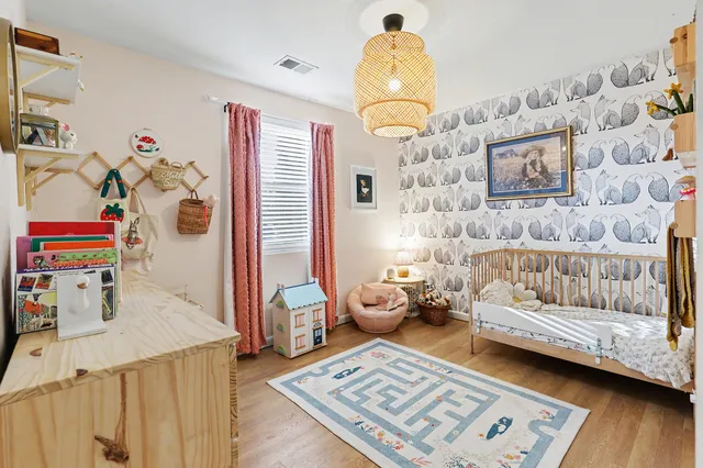 a bedroom with furniture and a window