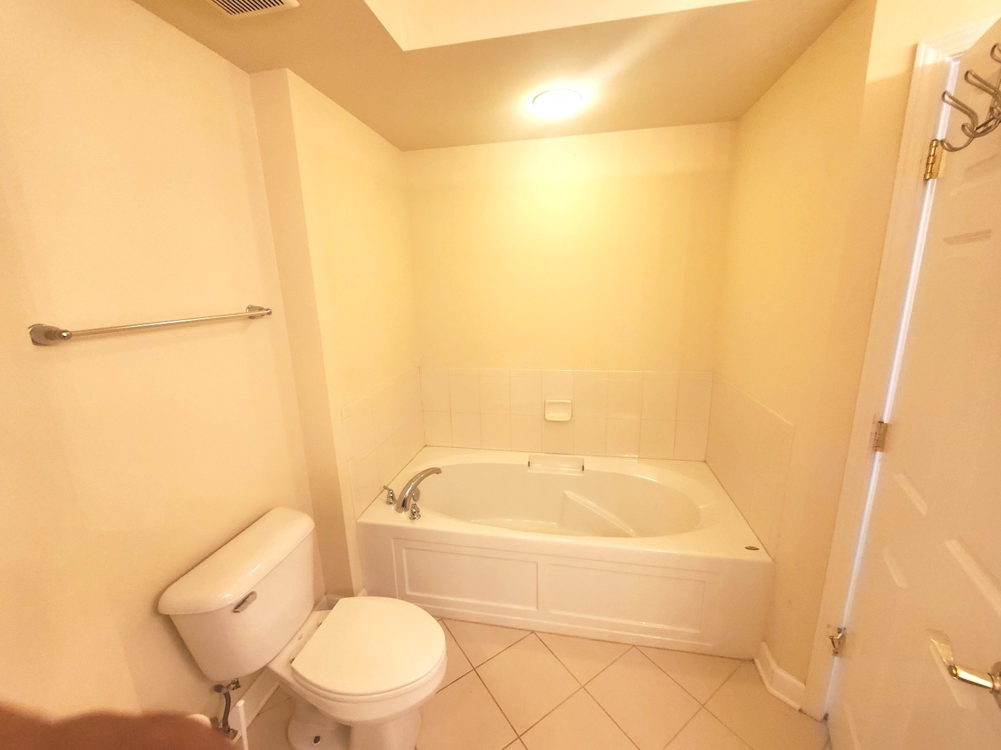 77 North Wolf Road, Unit 310 Northlake, IL 60164 - Photo 12 of 13 a bathroom with a toilet and a bathtub