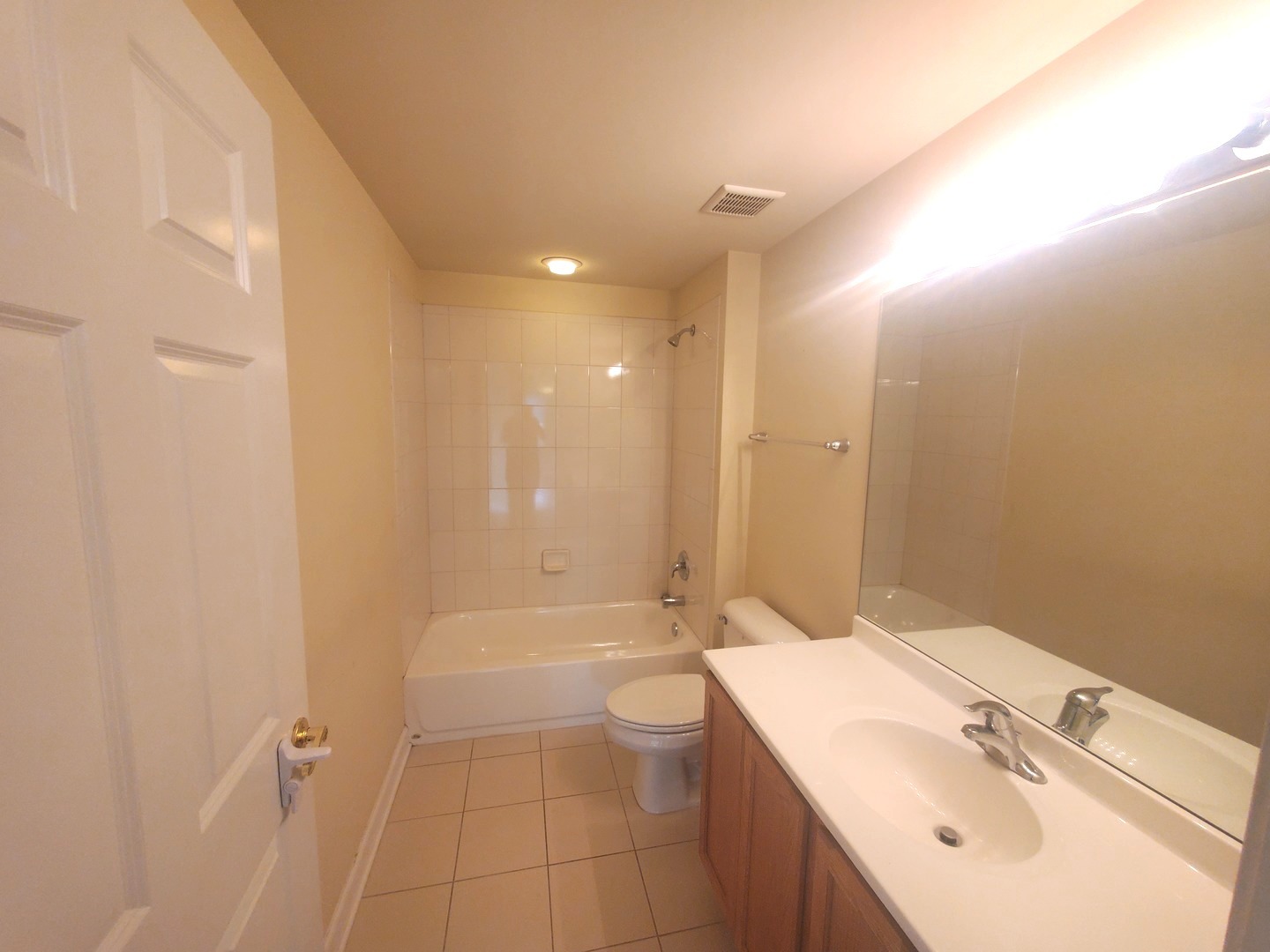 77 North Wolf Road, Unit 310 Northlake, IL 60164 - Photo 7 of 13 a bathroom with a sink a toilet and shower