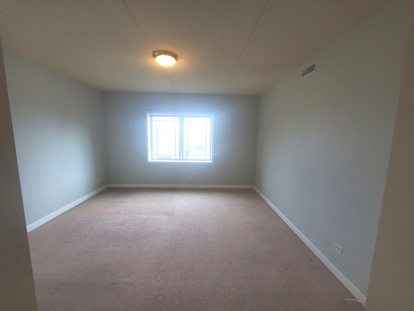 77 North Wolf Road, Unit 310 Northlake, IL 60164 - Photo 9 of 13 an empty room with a window