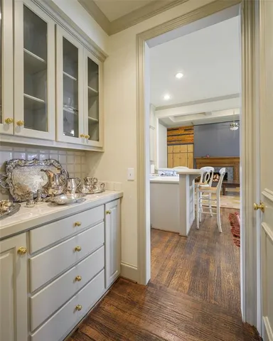 a view of a kitchen cabinets and a wooden floor