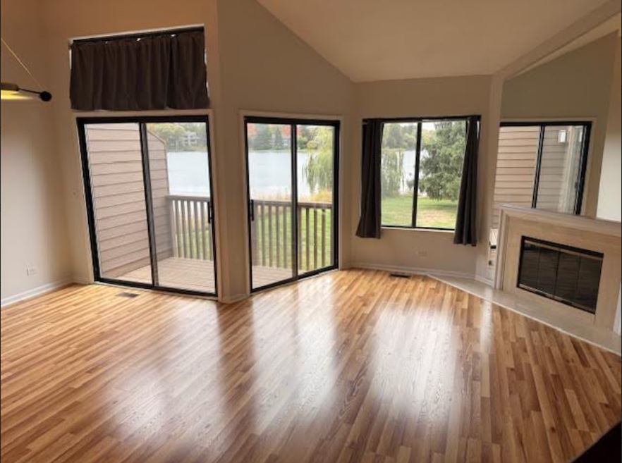 357 Indian Point Lake Barrington, IL 60010 - Photo 5 of 14 a view of a room with wooden floor and fireplace