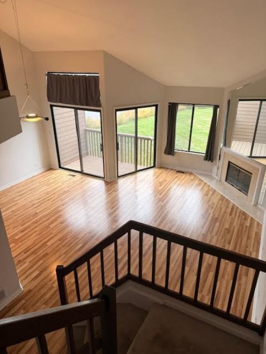357 Indian Point Lake Barrington, IL 60010 - Photo 10 of 14 a view of an empty room with wooden floor and windows