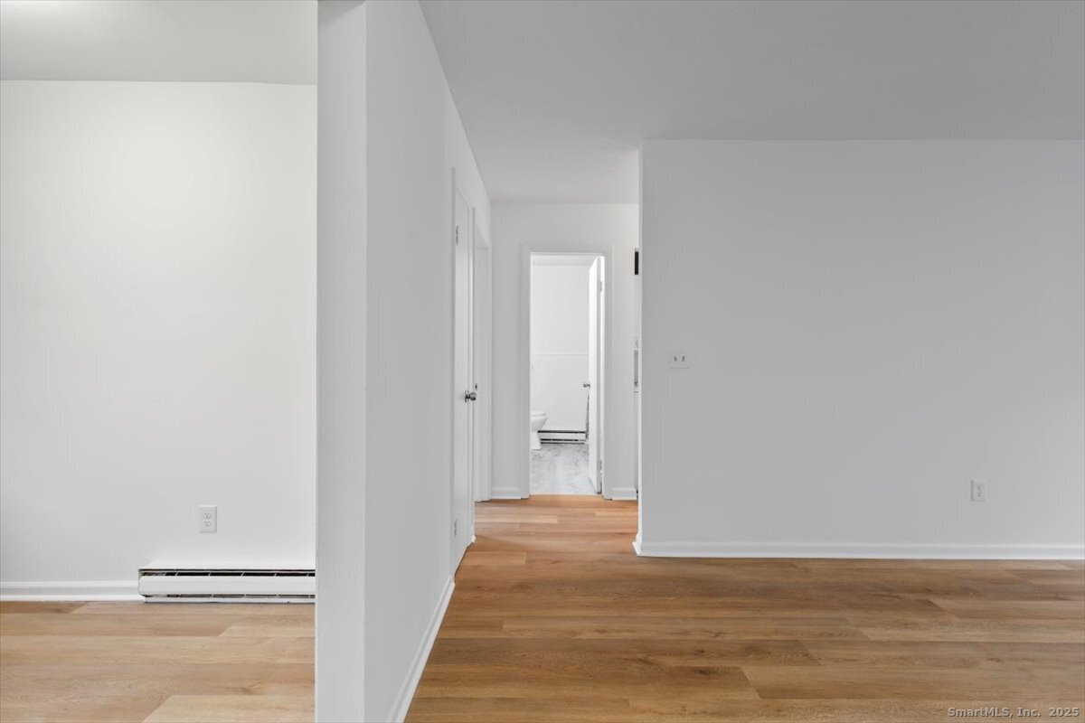 2998 Madison Avenue, Unit C Bridgeport, CT 06606 - Photo 15 of 24 a view of a room with wooden floor