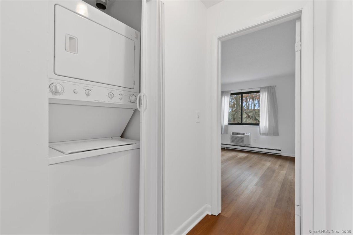 2998 Madison Avenue, Unit C Bridgeport, CT 06606 - Photo 16 of 24 a view of a hallway with wooden floor
