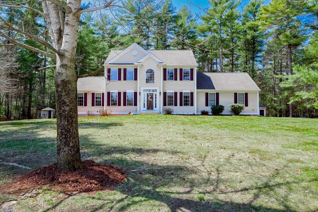 57 Harvest Circle Wareham, MA 02576 - Photo 1 of 39 a front view of a residential houses with yard and green space