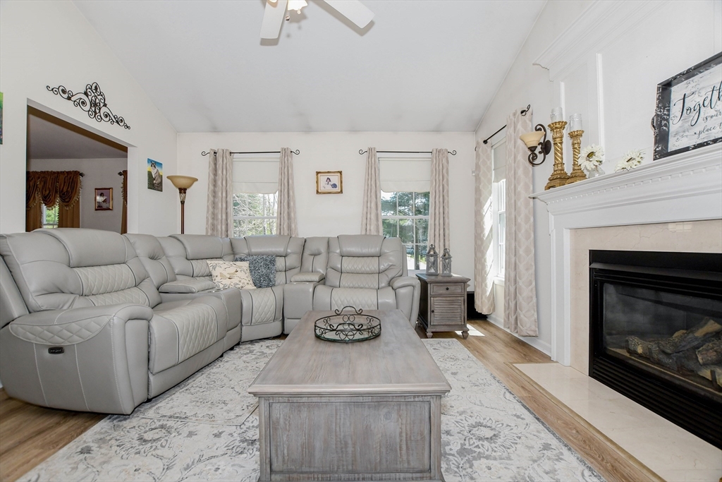 57 Harvest Circle Wareham, MA 02576 - Photo 12 of 39 a living room with furniture and a fireplace