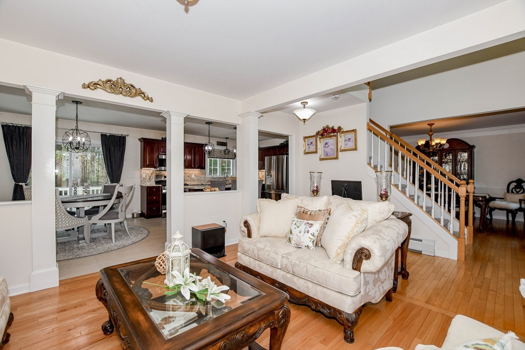 57 Harvest Circle Wareham, MA 02576 - Photo 14 of 39 a living room with furniture and a wooden floor