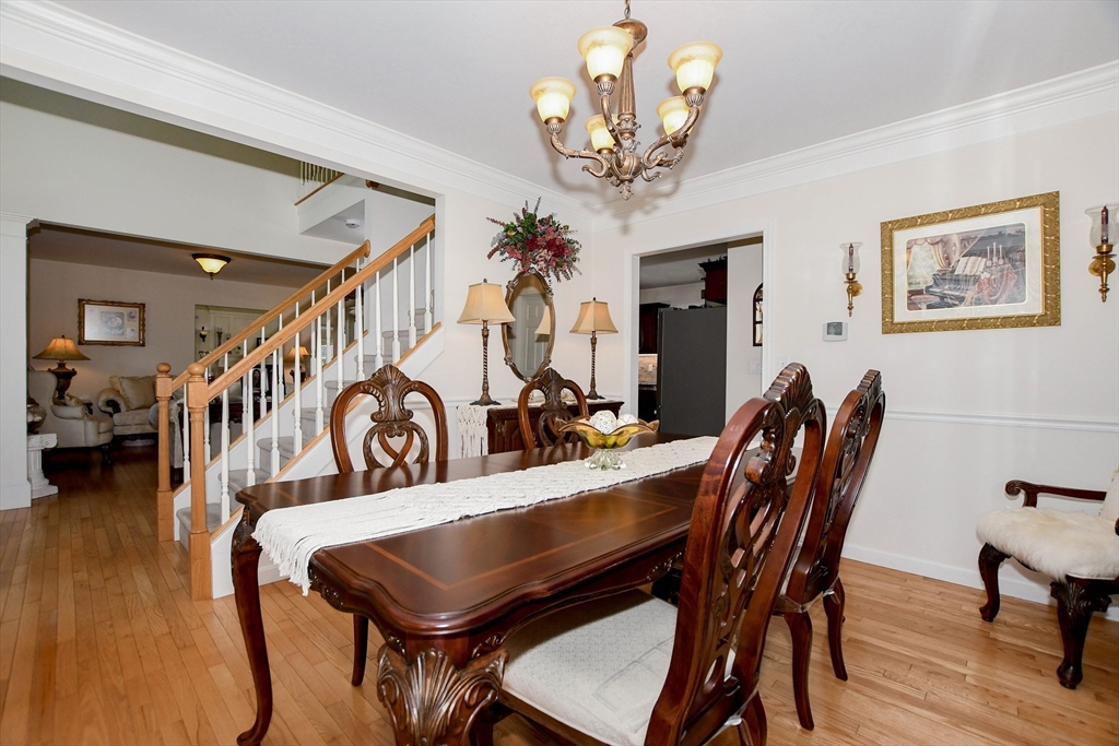 57 Harvest Circle Wareham, MA 02576 - Photo 16 of 39 a view of a dining room with furniture and wooden floor