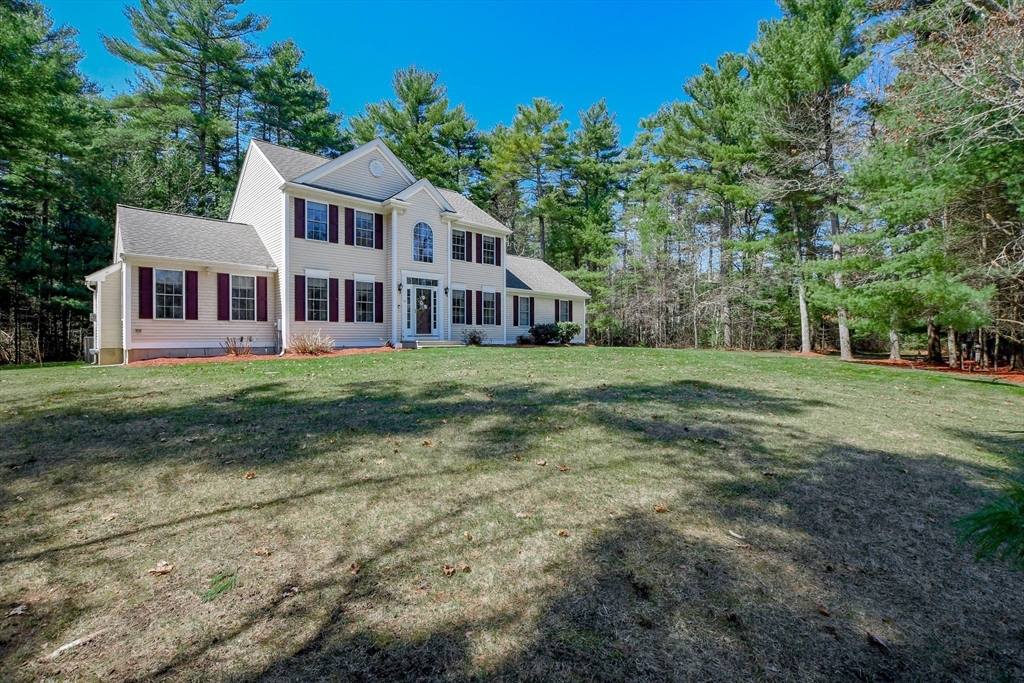 57 Harvest Circle Wareham, MA 02576 - Photo 2 of 39 a front view of a house with a yard