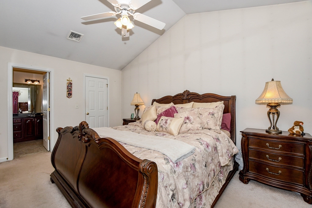 57 Harvest Circle Wareham, MA 02576 - Photo 21 of 39 a bedroom with a bed and a lamp on the dresser