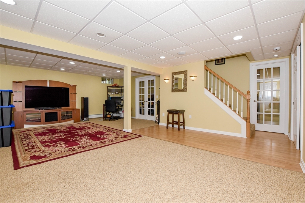 57 Harvest Circle Wareham, MA 02576 - Photo 29 of 39 a living room with furniture and a flat screen tv