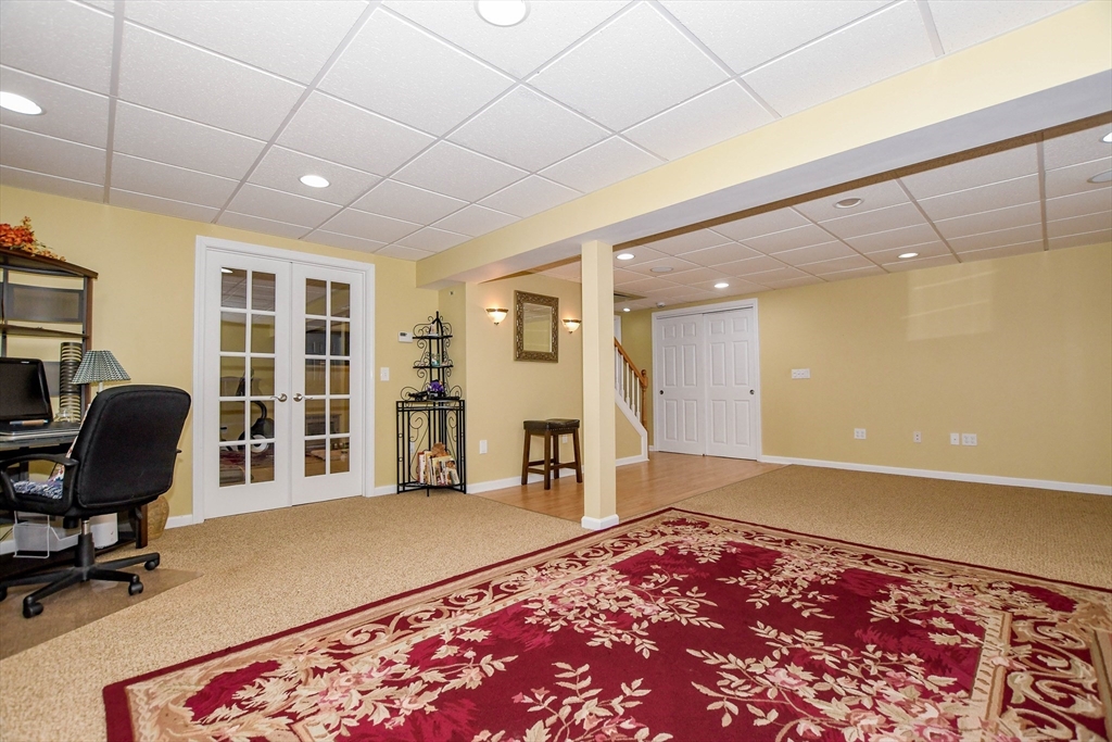 57 Harvest Circle Wareham, MA 02576 - Photo 30 of 39 a workspace with furniture and a rug