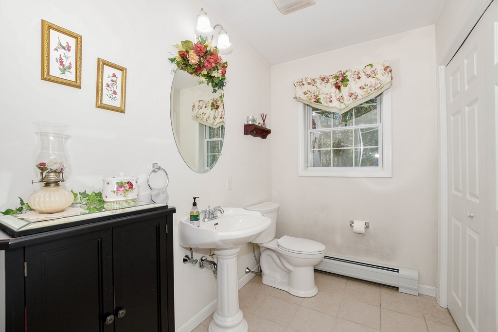 57 Harvest Circle Wareham, MA 02576 - Photo 32 of 39 a bathroom with a sink mirror and toilet