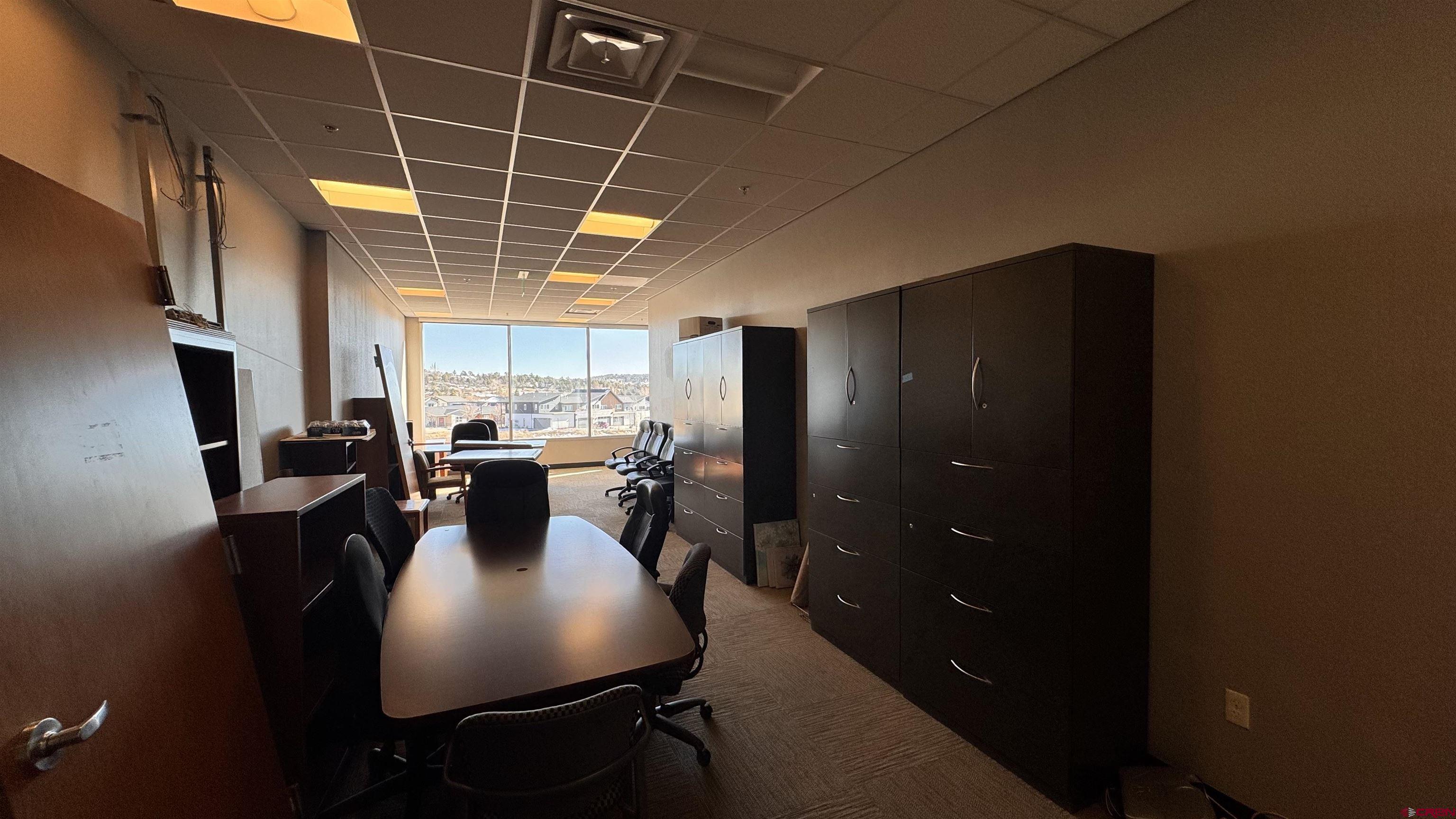65 Mercado Street, Unit 225 Durango, CO 81301 - Photo 13 of 18 a view of a dining room with furniture window and wooden floor