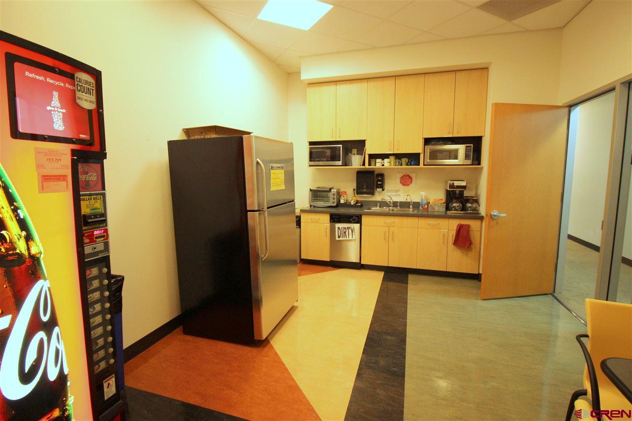 65 Mercado Street, Unit 225 Durango, CO 81301 - Photo 17 of 18 a kitchen with stainless steel appliances a refrigerator and a stove