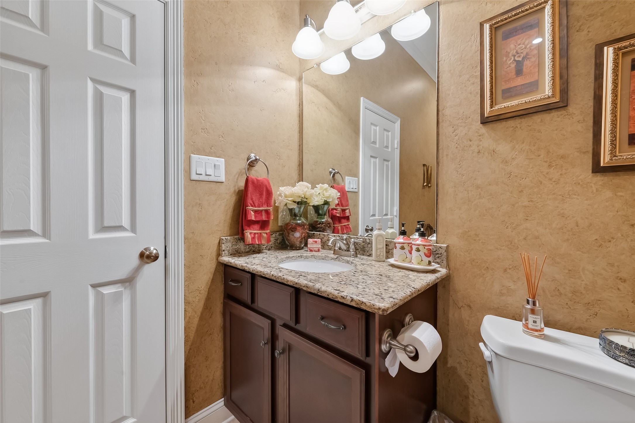 18622 Yorkshire Manor Court Spring, TX 77379 - Photo 14 of 49 a bathroom with a sink vanity mirror and toilet