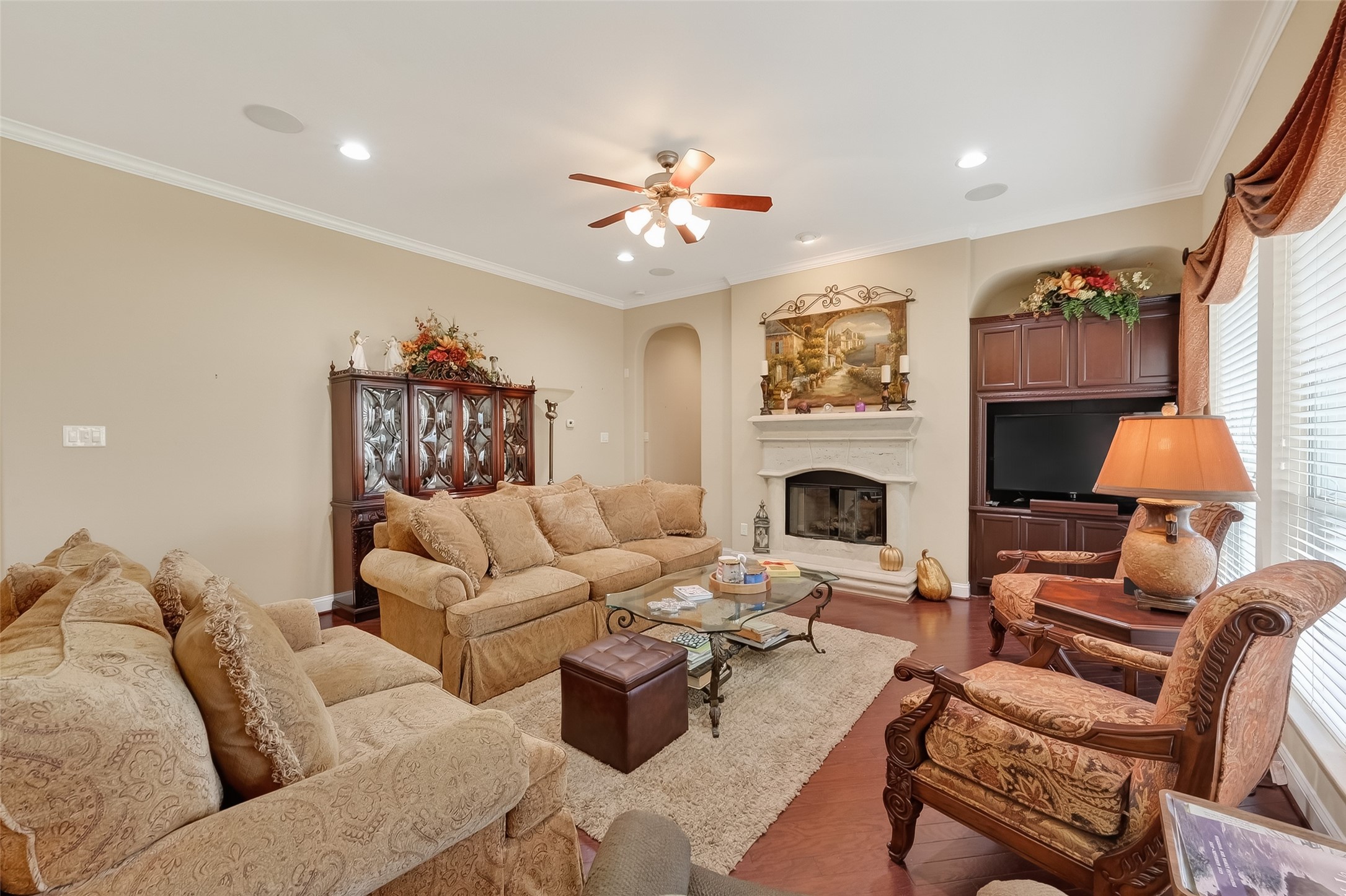 18622 Yorkshire Manor Court Spring, TX 77379 - Photo 19 of 49 a living room with furniture and a fireplace