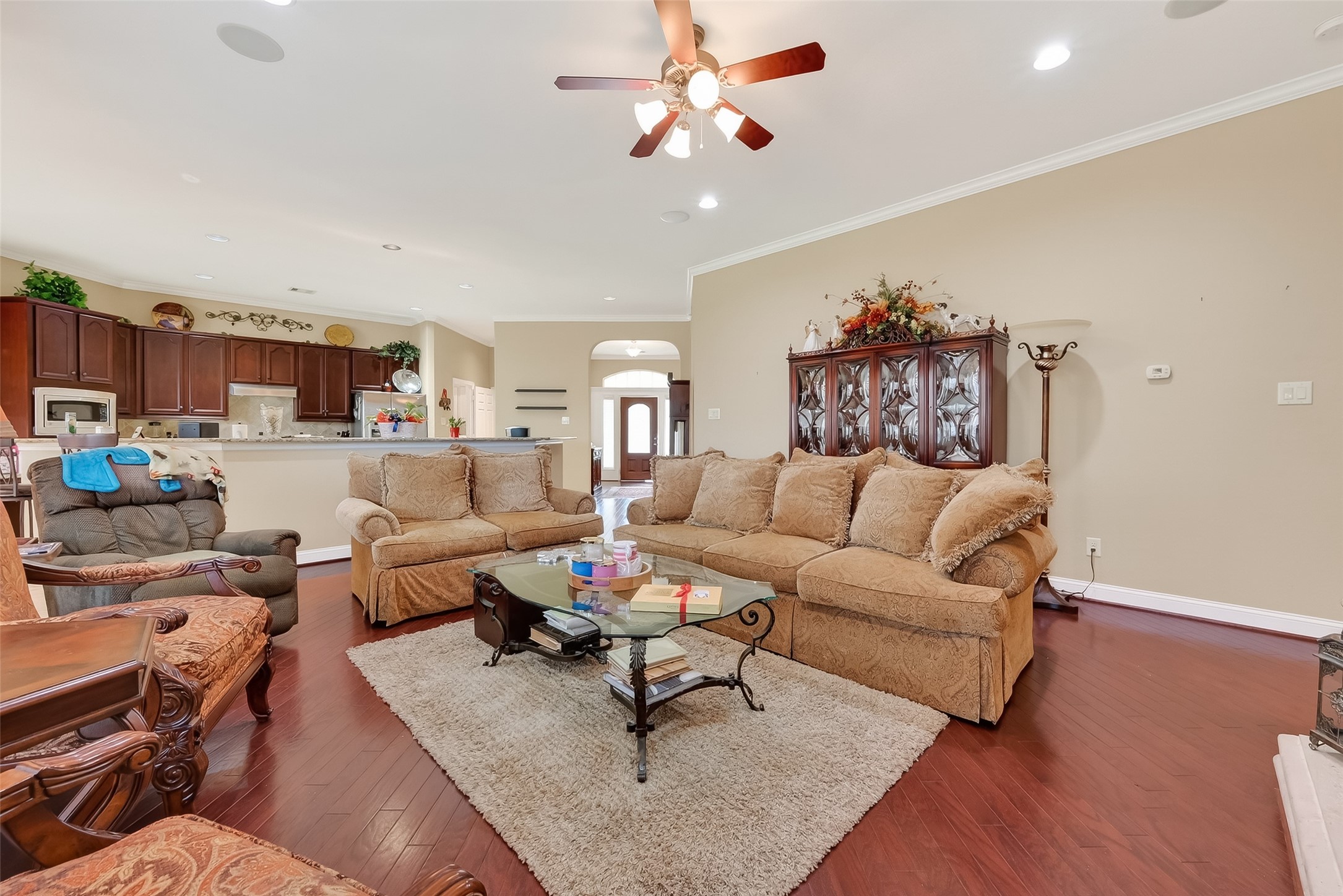 18622 Yorkshire Manor Court Spring, TX 77379 - Photo 21 of 49 a living room with furniture kitchen view and a chandelier